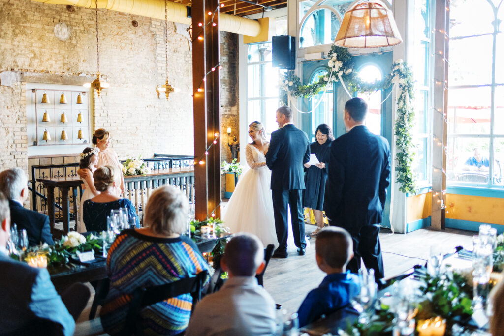 Bride is laughing with joy on her ceremony.