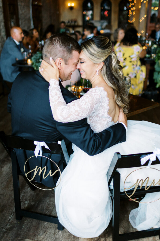 Minnesota wedding photographer capturing the bride and groom in the moment with their heads touching at Aster Weddings & Events.
