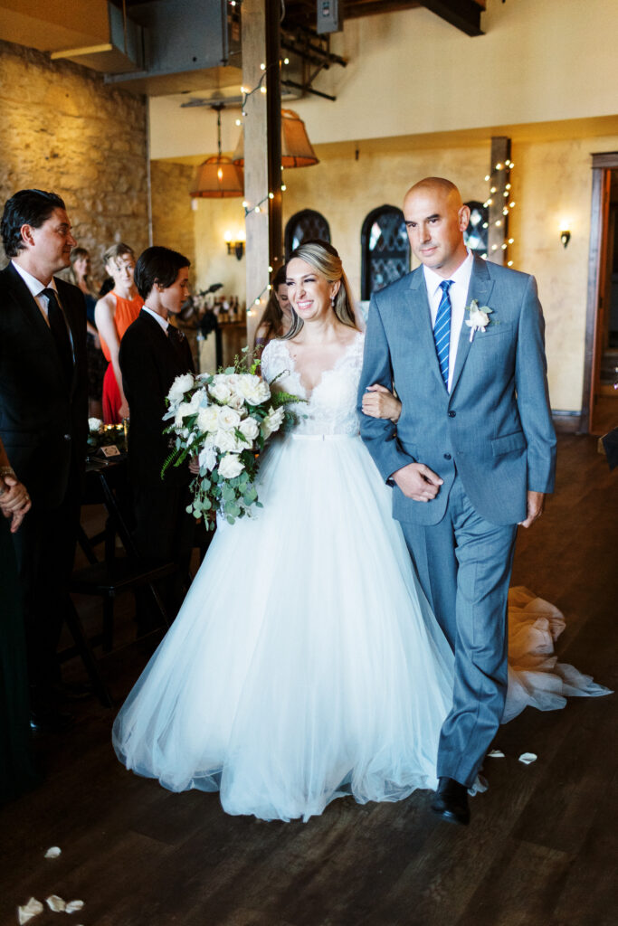 Here comes the bride, walking down the aisle.