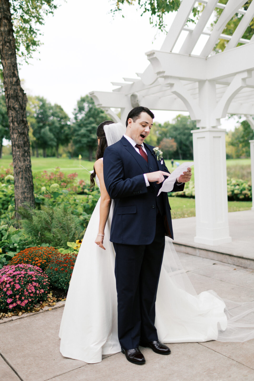 The groom is reading his vows to her in private at Bearpath Golf and Country Club
