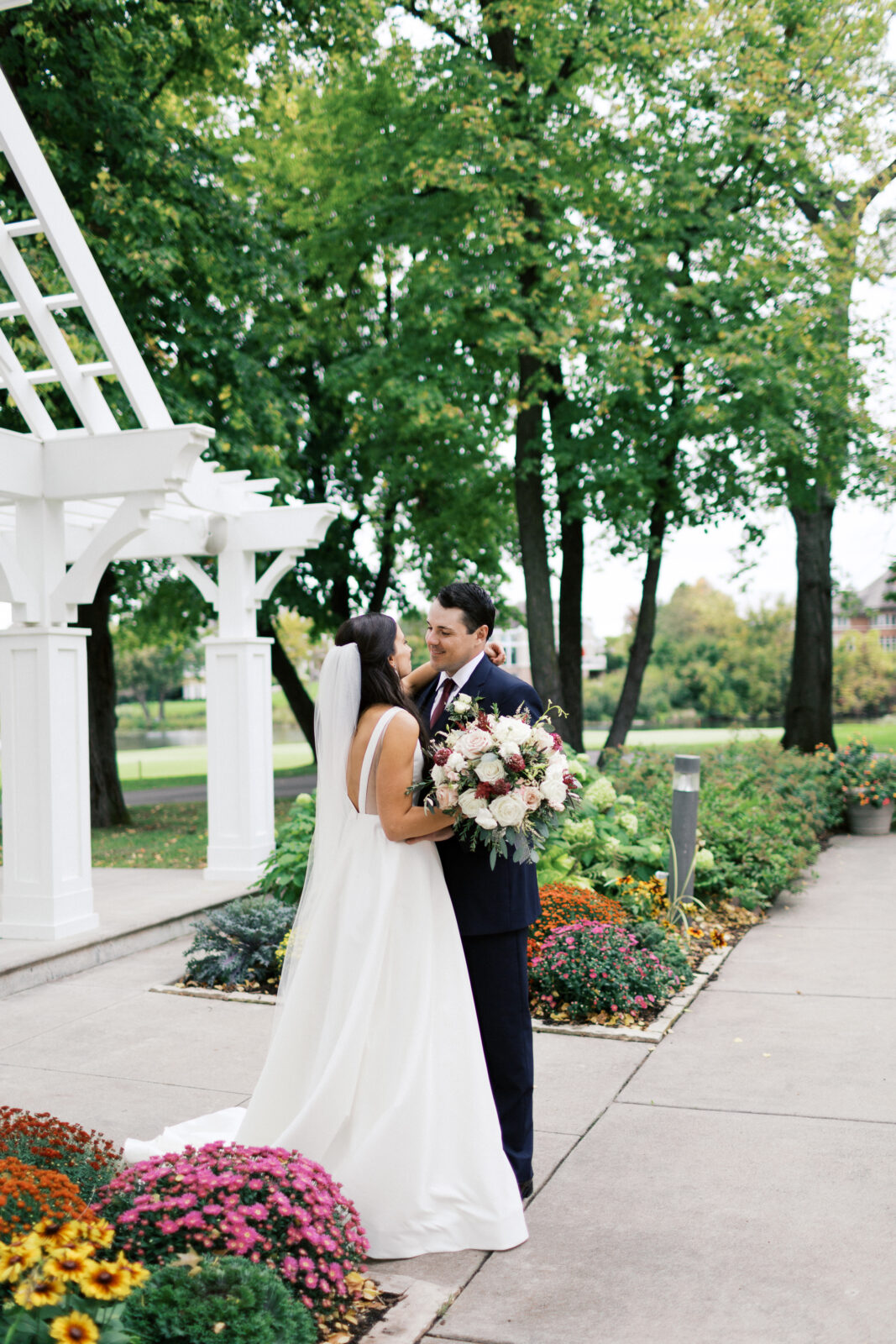 Groom is looking at his bride with a smile