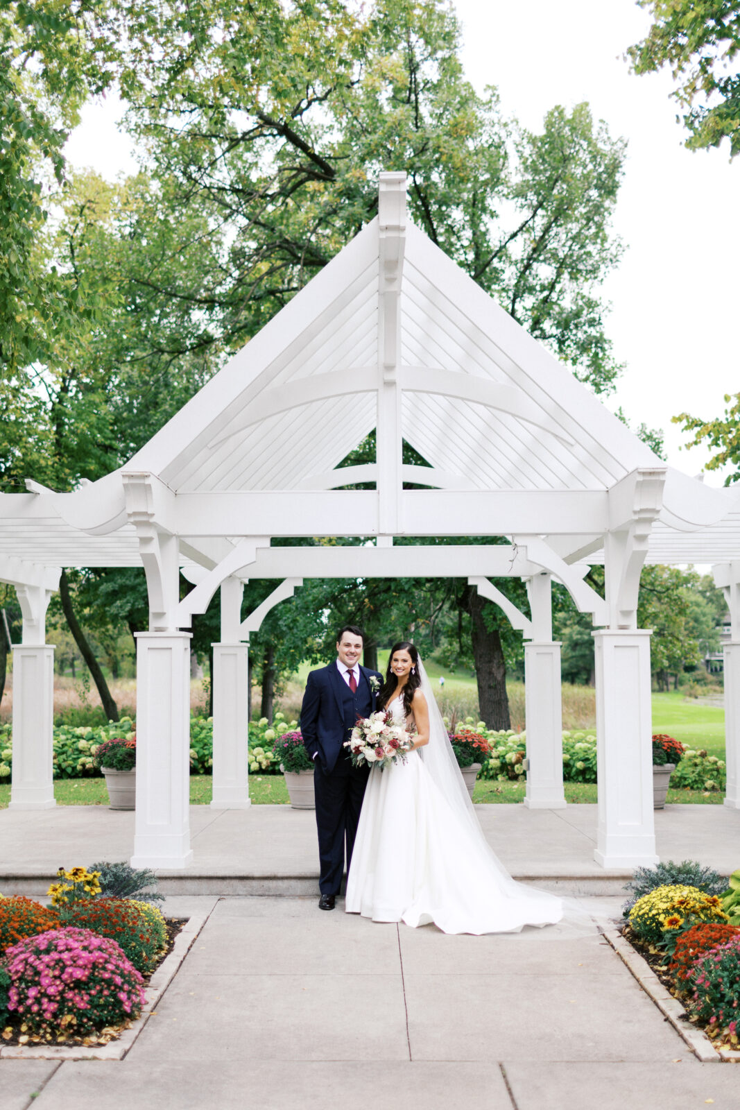 Bride and groom posing for a photo.