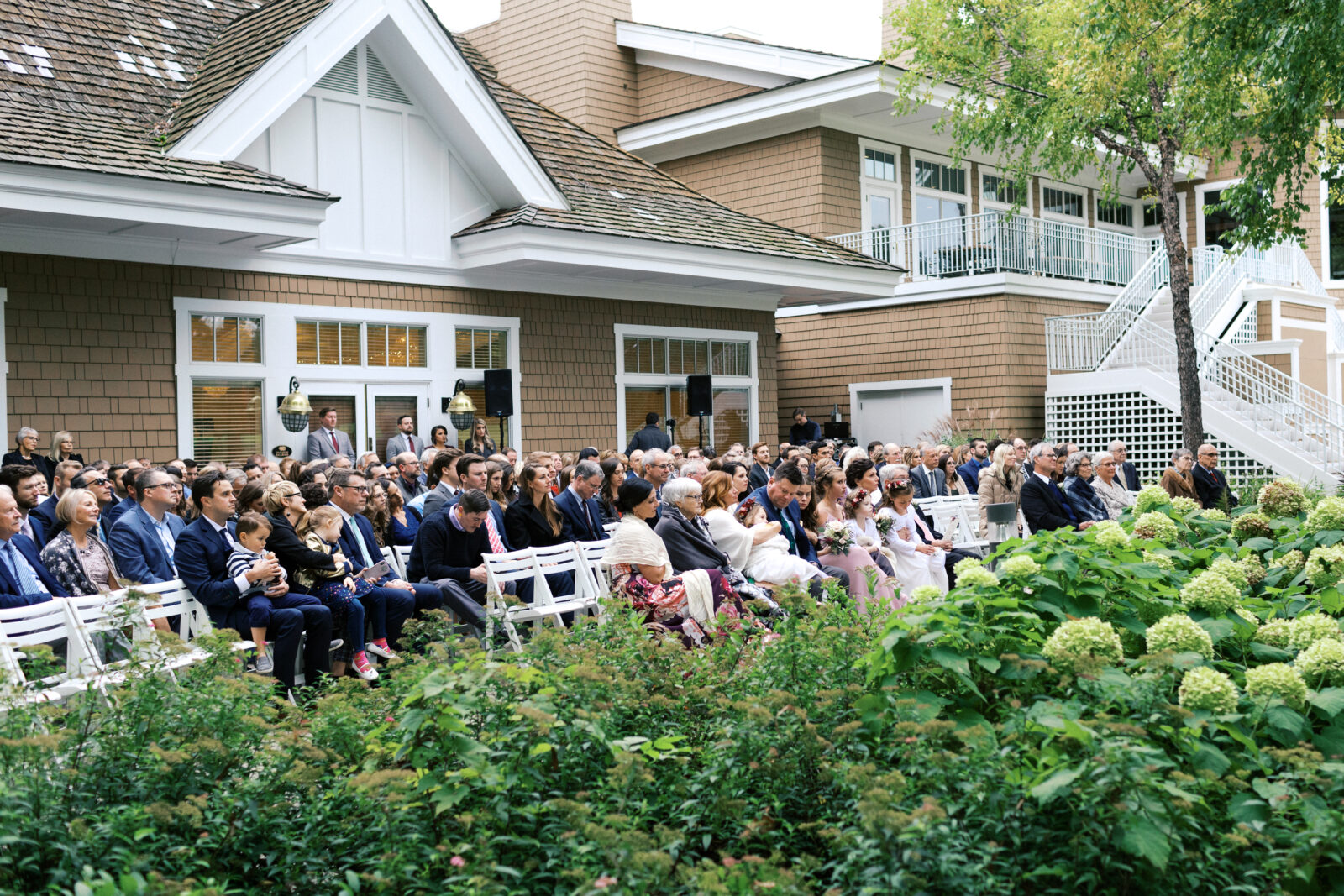 image of lots of guests attending a wedding ceremony at Bearpath Golf.