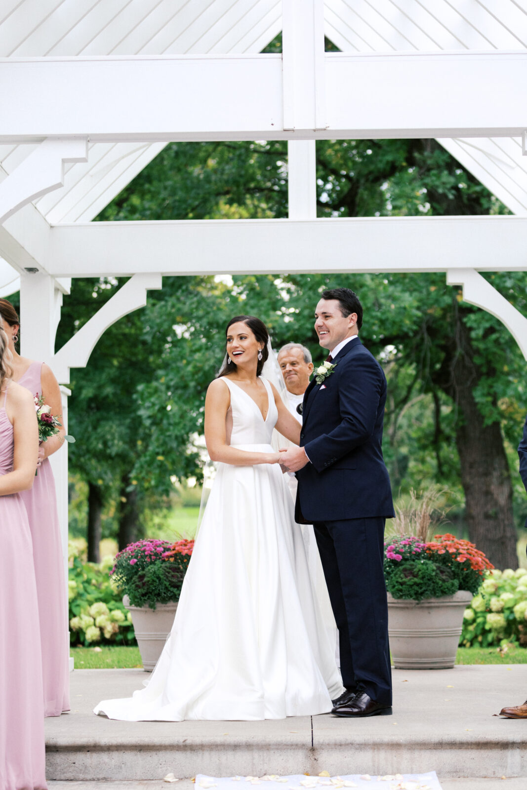 Sarah and Tony were laughing during their wedding ceremony. They looked so happy and in love.