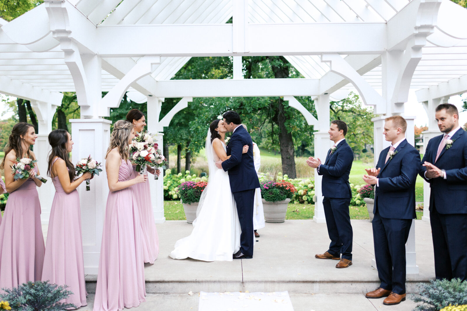 Happy newly married couple kissing at the wedding ceremony in Minnesota.