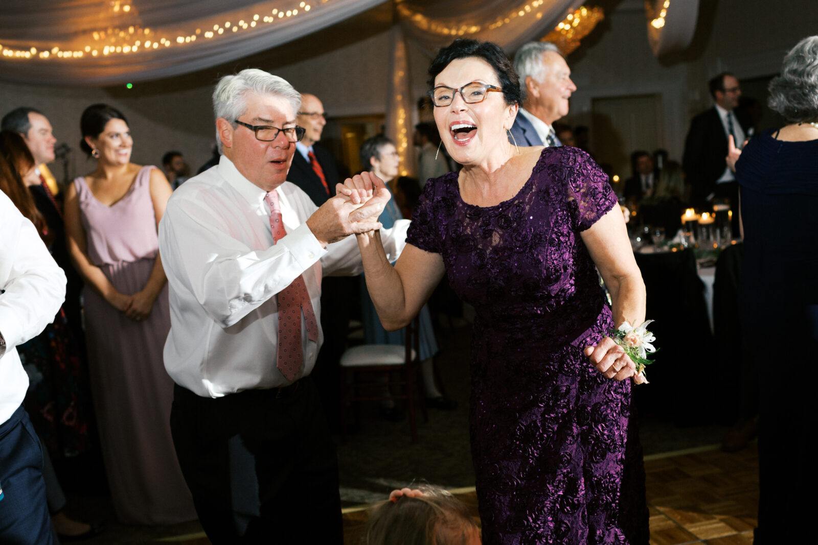 Mom and dad dancing at their daughter's wedding at the Eden Prairie wedding venue. 