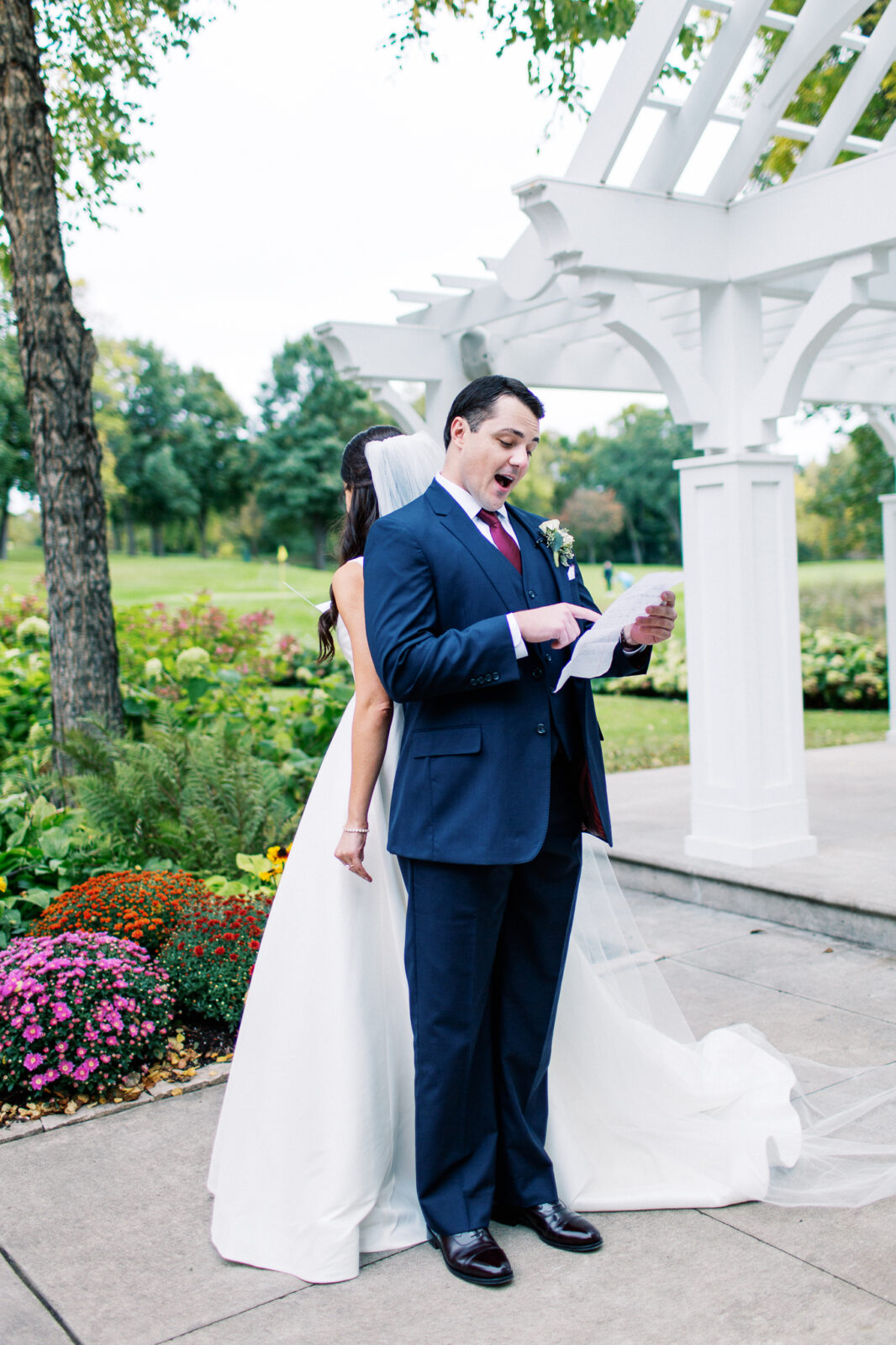 The groom is reading his vows to her in private at Bearpath Golf and Country Club