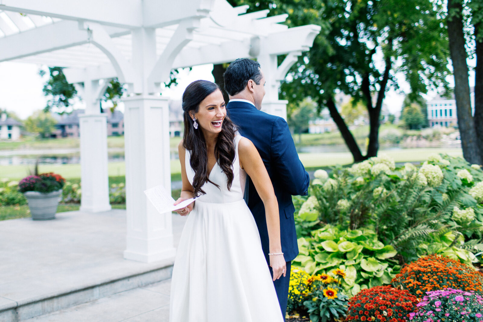 The bride is reading her vows to him.