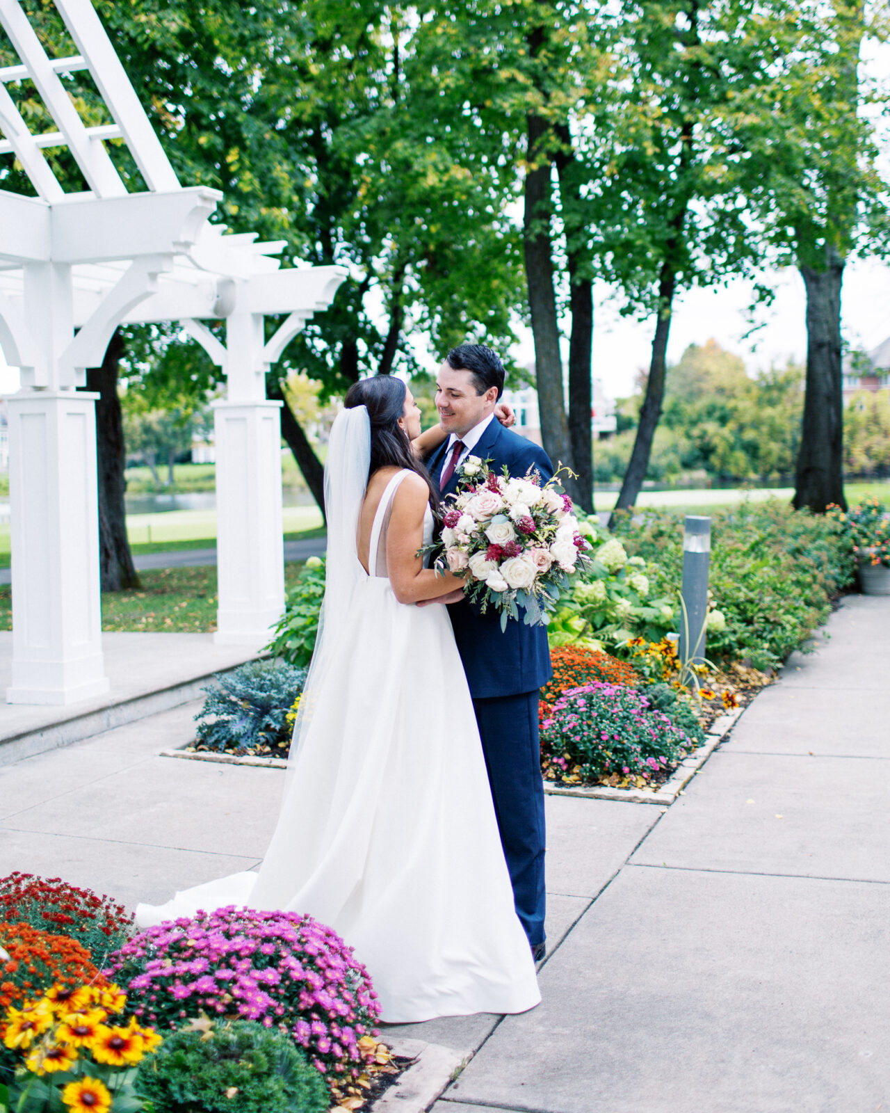 Groom is looking at his bride with a smile