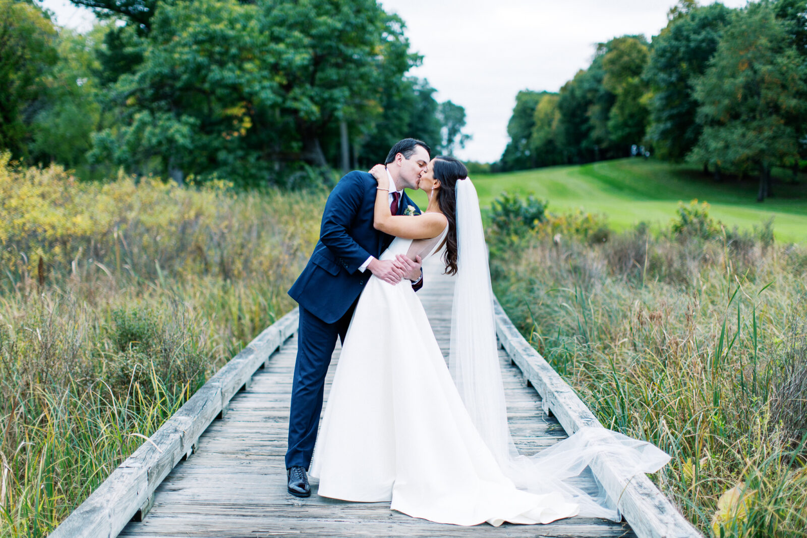 Bride and groom kissing, Toly Dzyuba photography is in action capturing the moment