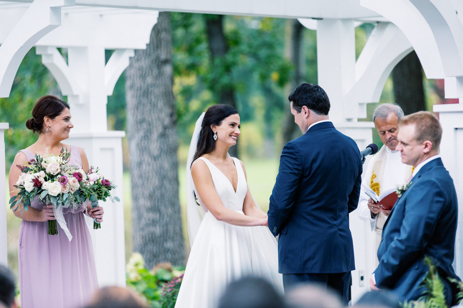 Bride is smiling on her ceremony