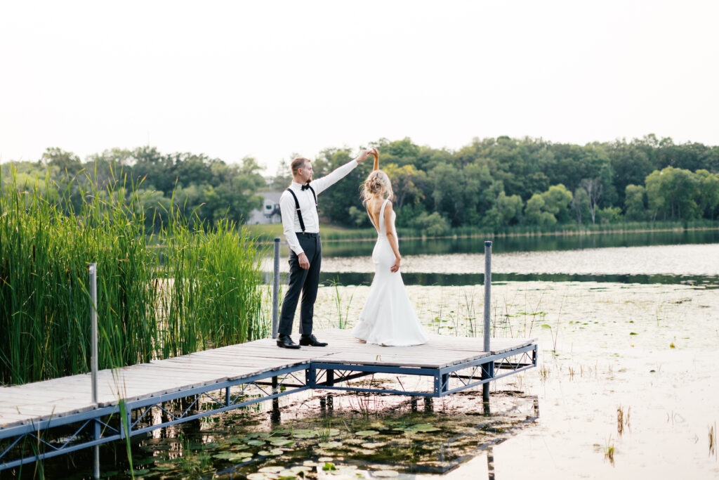 Bride and groom dancing on the dock at sunset - Detroit Lakes