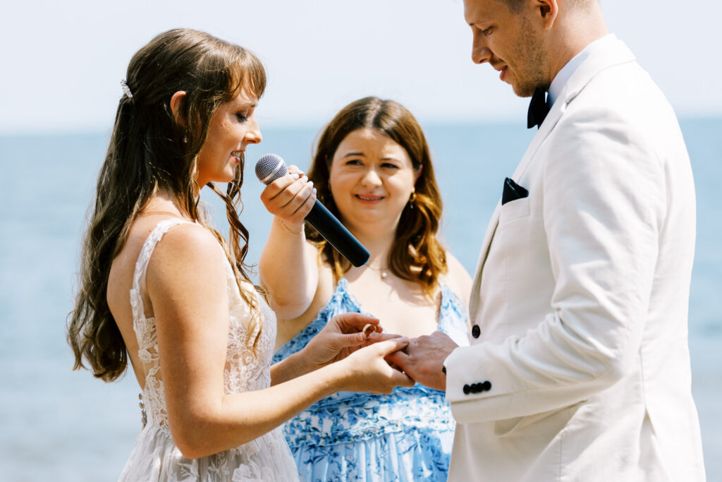 Toly Dzyuba Photography capturing North Shore wedding in Minnesota where bride and groom is exchanging their rings