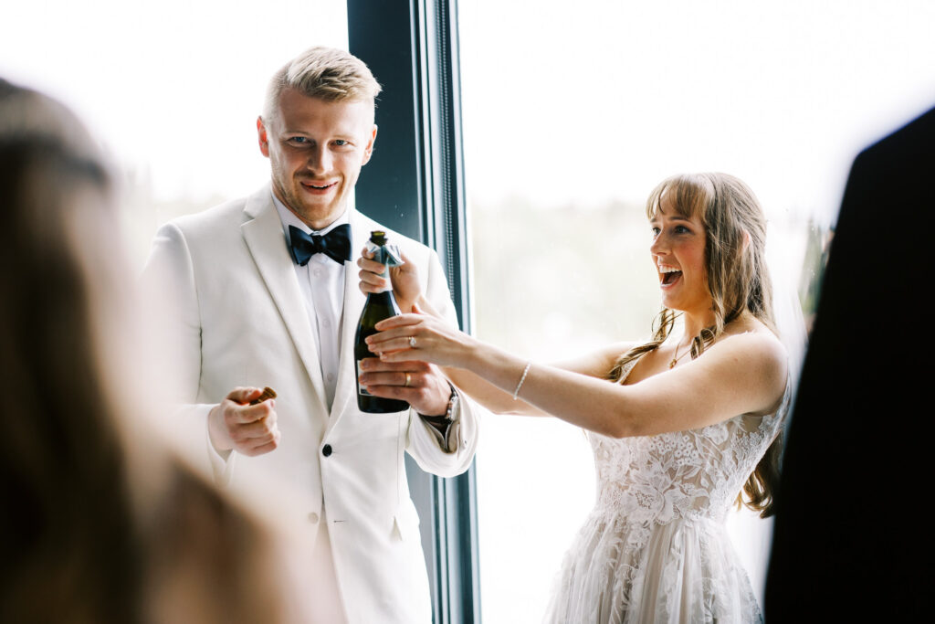 Champagne Bottle popped on North Shore in Minnesota by Toly Dzyuba Photography