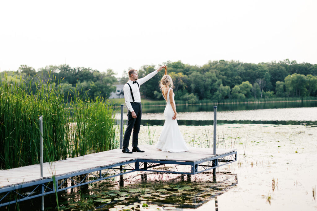 Bride and groom dancing on the dock with the sunset, capturing love in its purest.