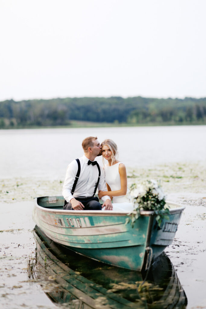 Bride getting kissed by the groom at golden hour, capturing love in its purest.