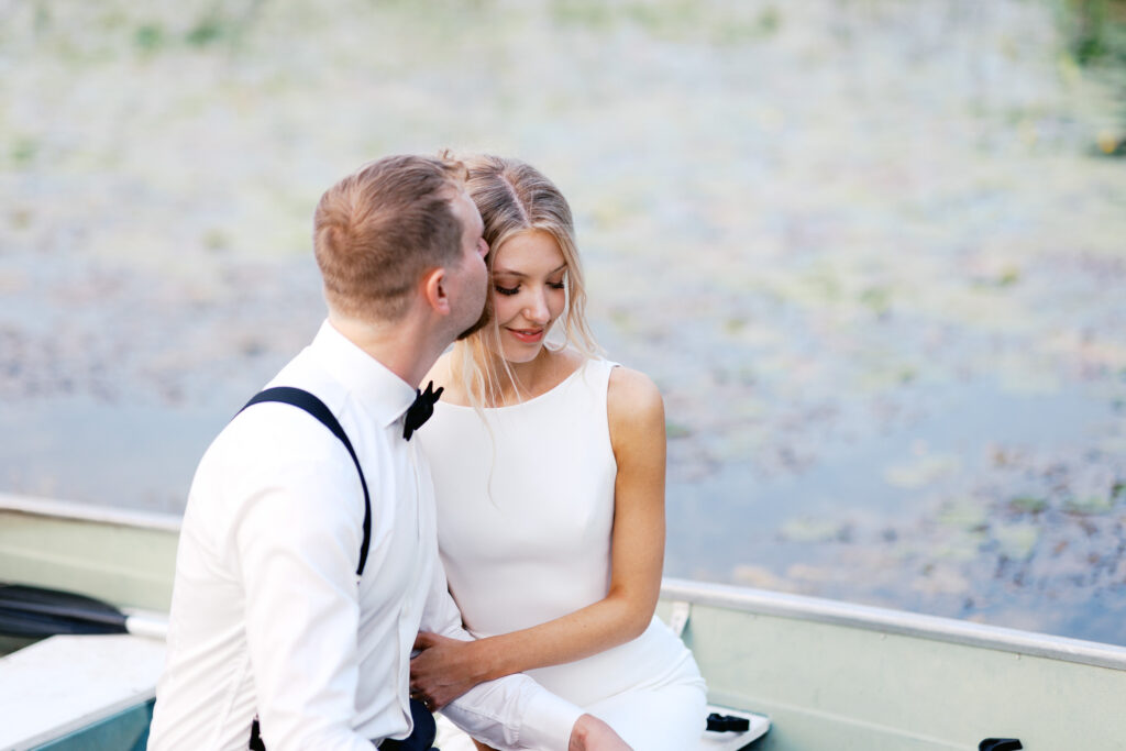 Photographing Sophia and Cody in the boat kissing her.