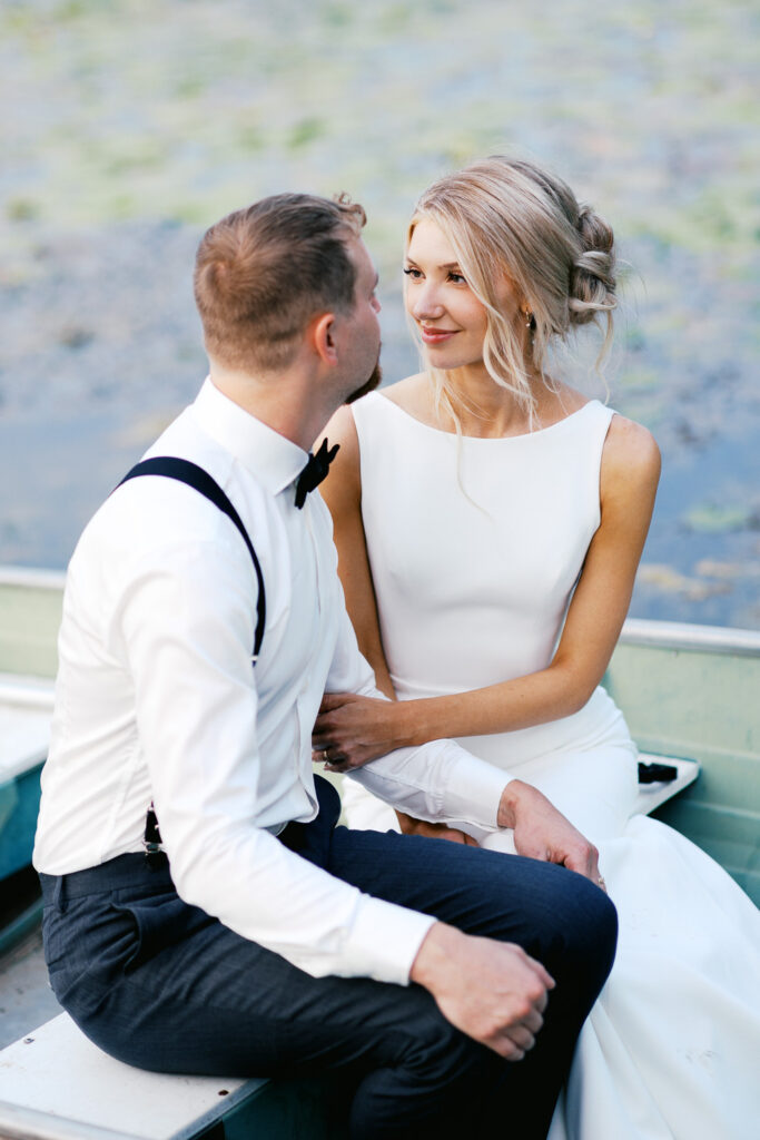 Groom sat mesmerized in the boat, his eyes locked on her while soaking in the beauty of the moment at golden hour. 