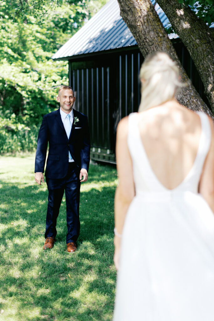 First look. Groom sees his Bride for the very first time at Ivory North captured by Toly Dzyuba Photography