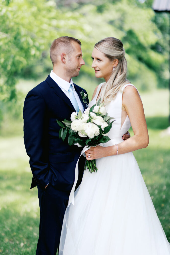 Bride and groom looking at each other's eyes. By Toly Dzyuba Photography - Minnesota wedding photographer 