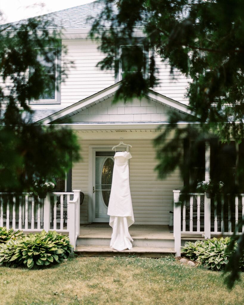 Wedding dress hanging at the entrance of Abella Weddings and Events wedding venue.