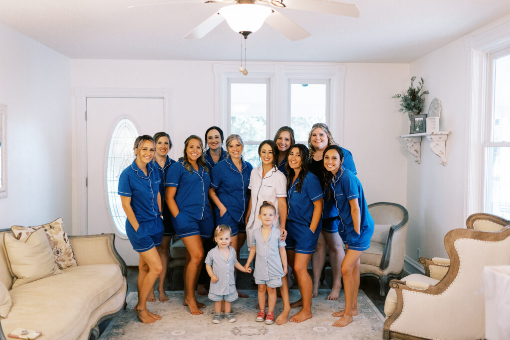 Wedding bridal party all in joyful mood at the cottage at Abella Weddings and Events in Minnesota, captured by Minnesota wedding photographer.