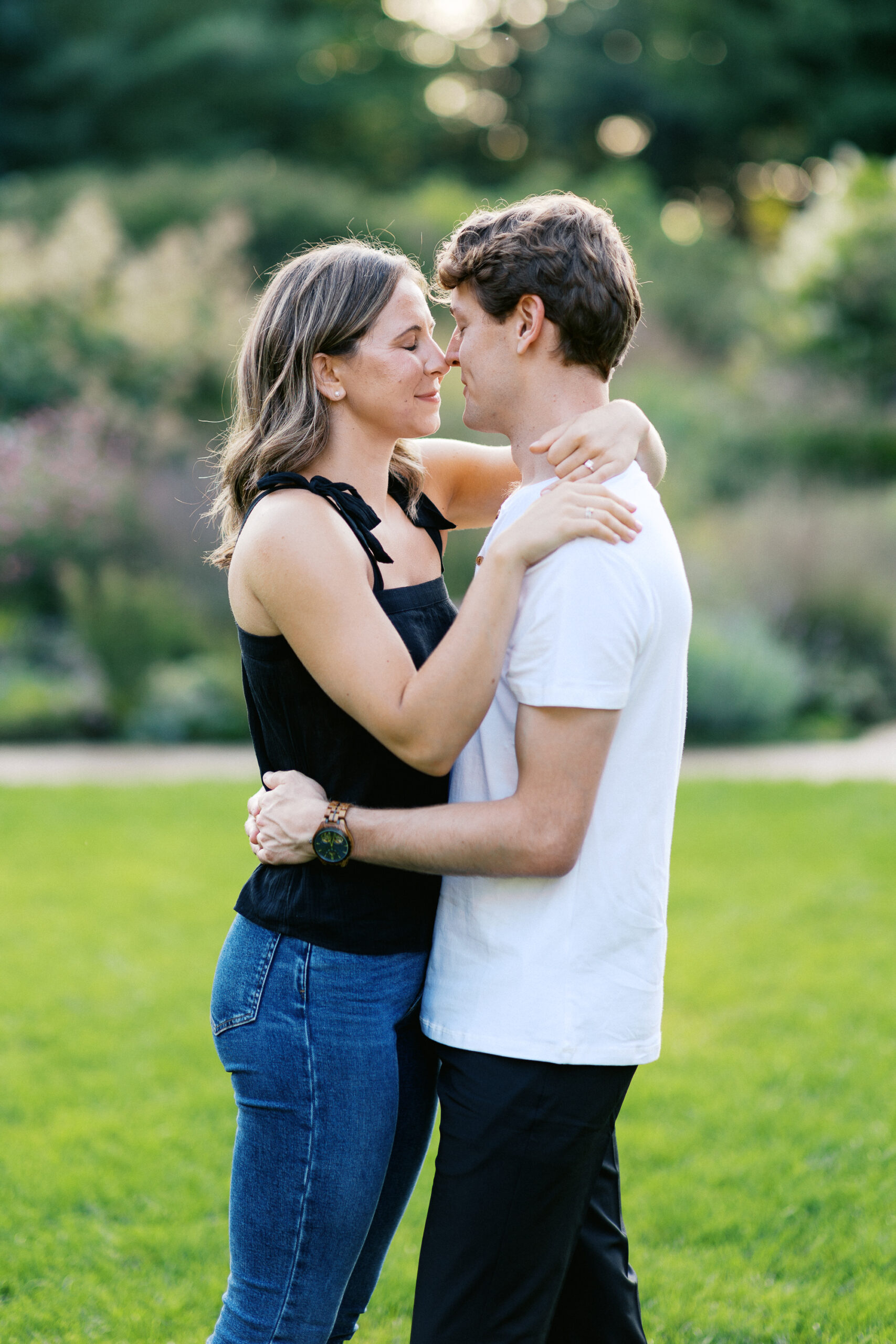 The couple stands at Noerenberg Gardens, their noses gently touching and eyes closed, sharing a moment of pure connection. Captured by Toly Dzyuba Photography.