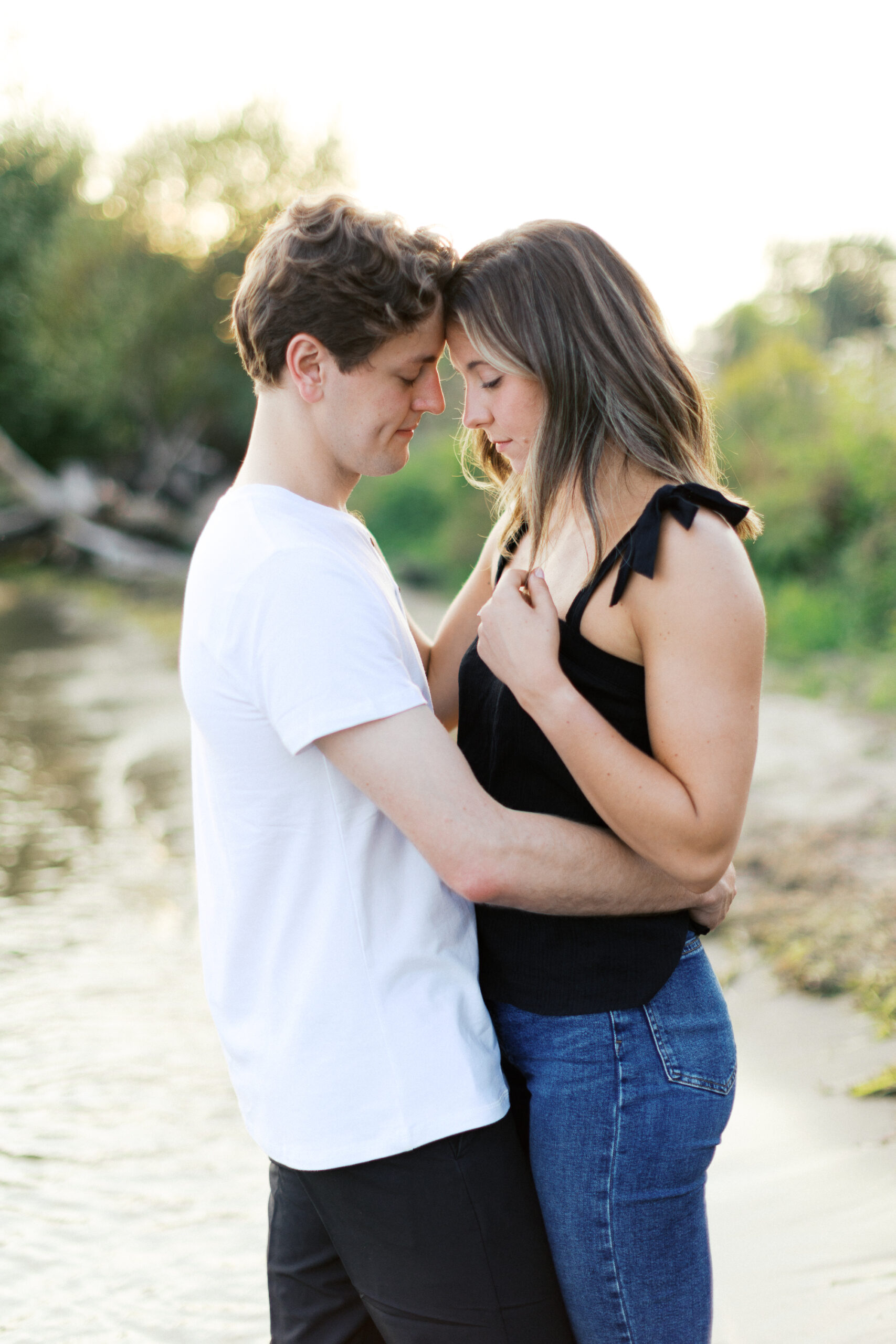 A quiet and intimate moment at Noerenberg Gardens as the couple gently touches foreheads, sharing a deep connection. Captured by Toly Dzyuba Photography.