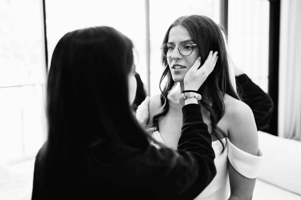 As a Minnesota wedding photographer, I had the privilege of being there to capture these heart-felt moments with the bride talking to her sister.