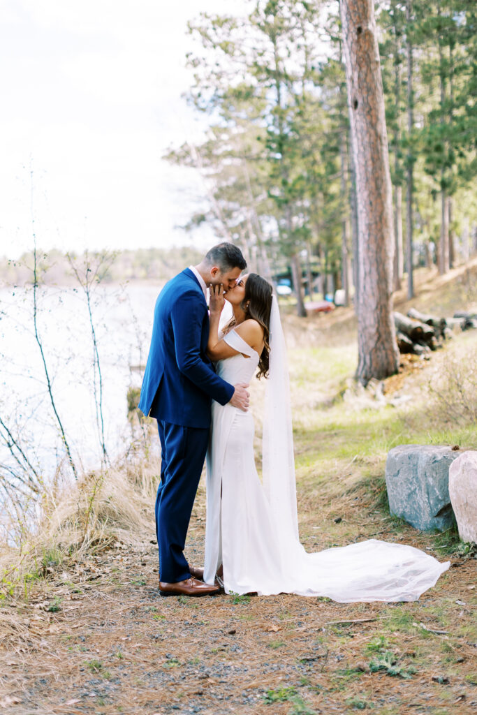 Bride and groom kiss at wedding at Catalyst at Nature Link.