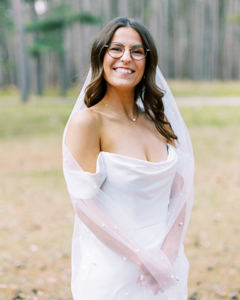 Bride looking in the camera and smiling