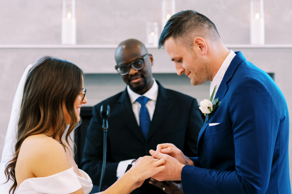 Bride and groom exchanging the rings. Catalyst by Nature Link resort.