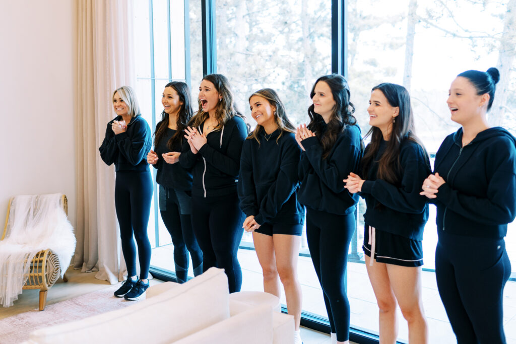 The bridesmaids' reaction to see the bride in her wedding dress for the first time. 