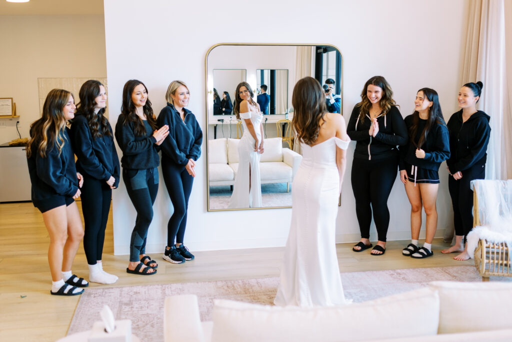 Bride looking in mirror getting ready for the ceremony at Catalyst by Nature Link.