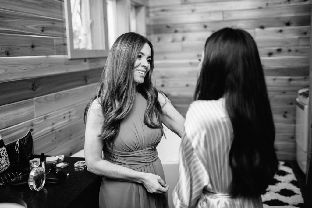 Mom looking at the bride with emotions and joy.