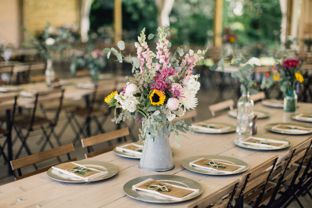 Gorgeous farm-style wedding bouquet sitting on the table during the wedding reception at Legacy Hill Farm.