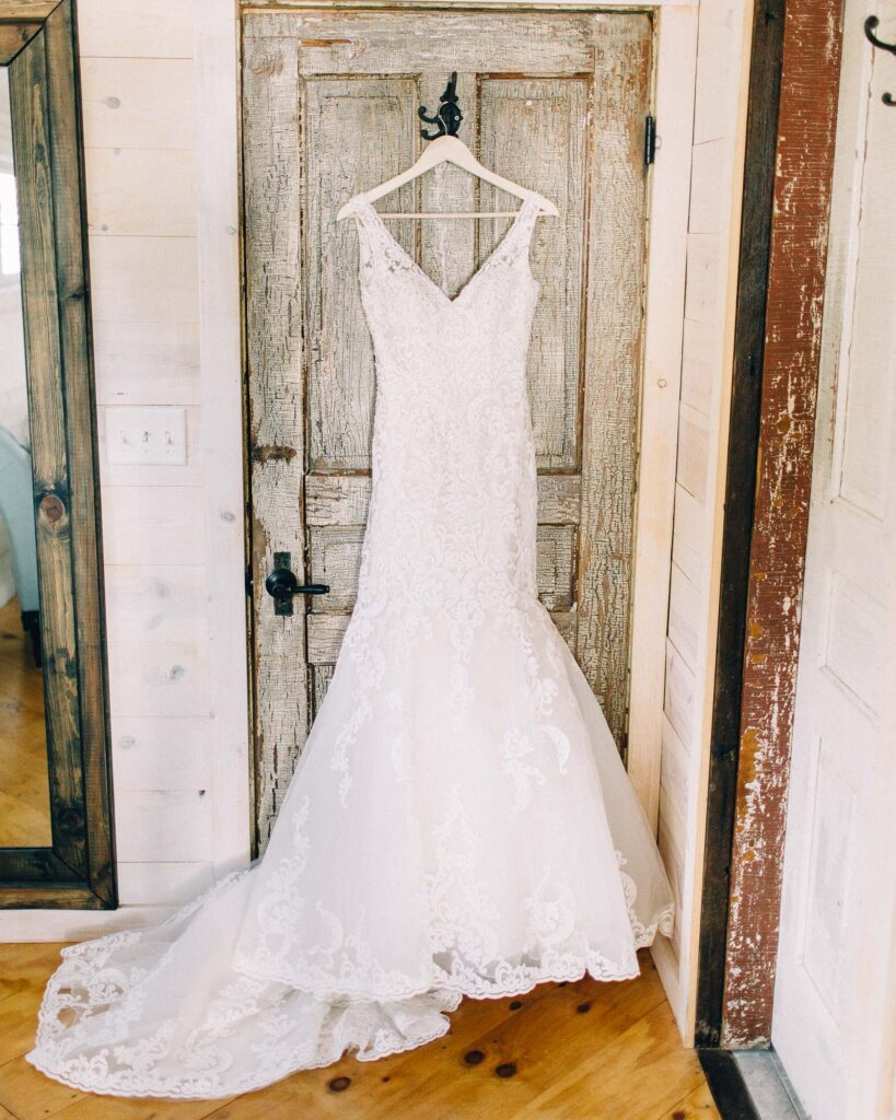 Dress hanging on a rustic door at Legacy Hill Farm.