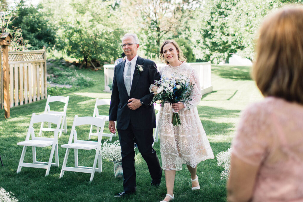 Father walking his daughter down the aisle v