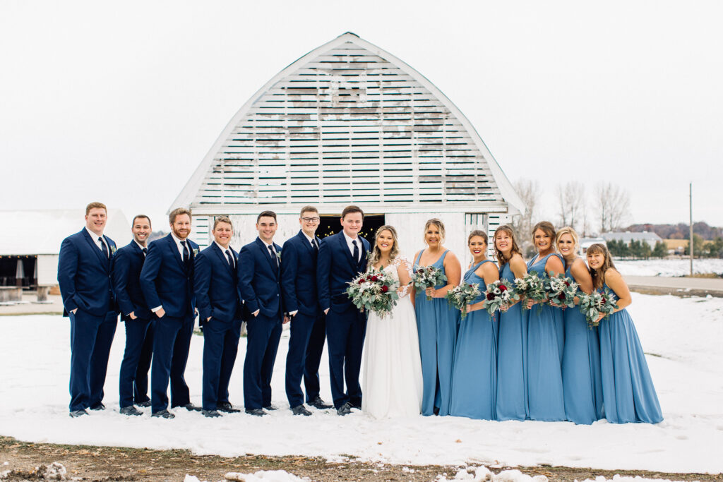 Wedding party all standing tall and smiling at The Cottage Farmhouse winter wedding. Captured by Toly Dzyuba Photography.