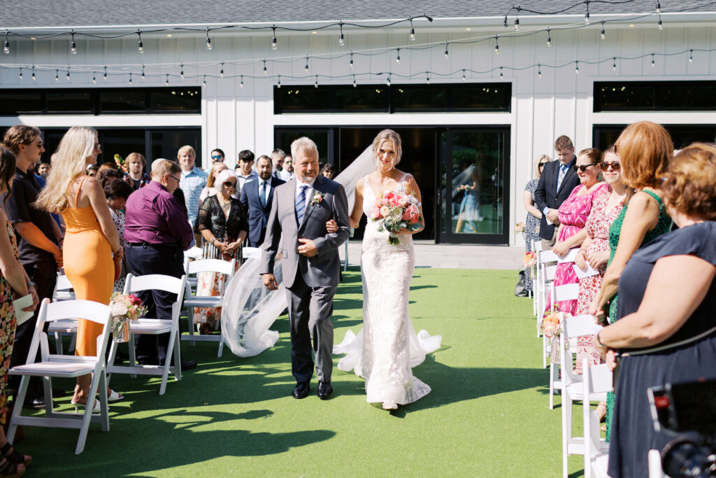Father walking down his daughter on the wedding day at The Hutton House, captured by Minnesota wedding photographer Toly Dzyuba Photography. 