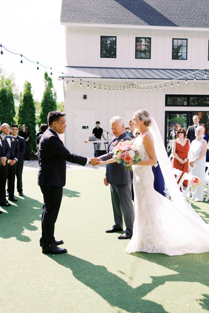 Father gives his daughter the bride to the man of her dreams at the Hutton House wedding in Minneapolis, captured by Minnesota wedding photographer Toly Dzyuba Photography. 