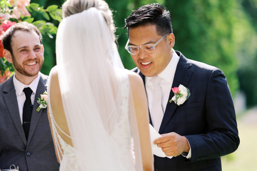 Groom is reading his vows, captured by Minnesota wedding photographer Toly Dzyuba Photography. 