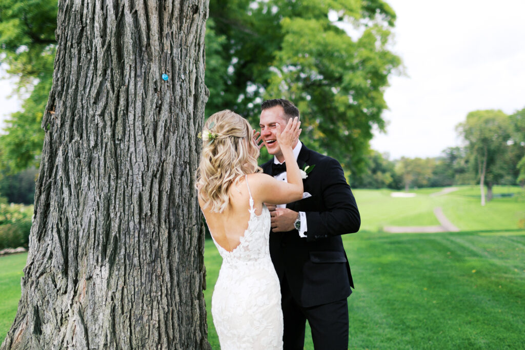 Emotional first look moment as the groom sees his bride for the first time, captured by Toly Dzyuba Photography.
