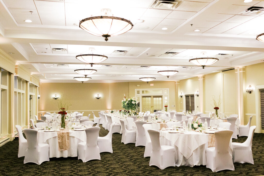 Reception setup with luxury decor and romantic florals at Minneapolis Golf Club wedding.